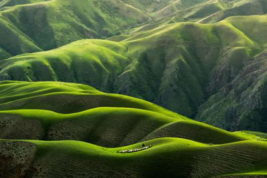 Aerial view of rolling green mountains